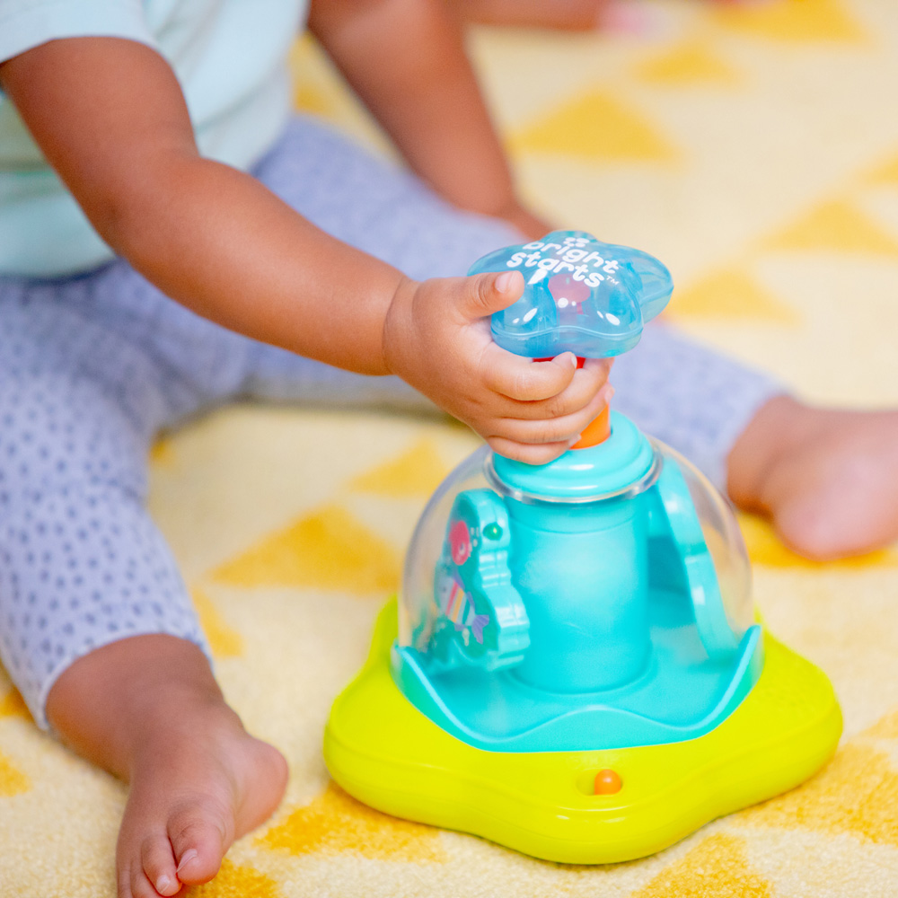 BRIGHT STARTS Hračka hudobná svietiaca Press&Glow Spinner 6m+